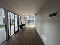 Cabine préfabriquée mobile de luxe modulaire extensible en conteneur écologique avec porte de sécurité en acier pour habitation ou bureau