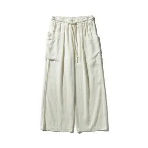 Pantalones de lino informales de pierna ancha retro de color sólido para hombre, cintura elástica, ajuste holgado, pantalones de calle con múltiples bolsillos
