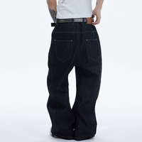 Jeans en denim délavé noir asymétrique à braguette boutonnée, coupe ample et jambe large, style streetwear, pour hommes, personnalisable OEM/ODM, faible MOQ