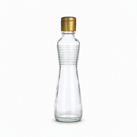 Bouteille en verre transparent pour huile et vinaigre avec bouchon métallique hermétique, idéale pour les assaisonnements et sauces de cuisine (vente en gros)