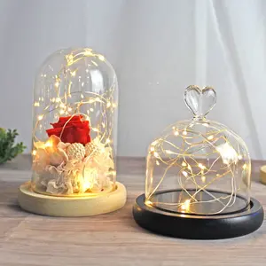 Atacado personalizado venda quente led mão soprado rosas flor brilhante sino frascos de vidro com base de madeira