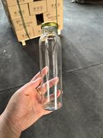 Bouteille en verre à prix d'usine 250ml 330ml 500ml avec bouchon métallique pour boissons, eau potable, jus, fruits, vin, café
