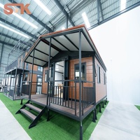 Maison modulaire préfabriquée en conteneur, prix d'usine, personnalisée, 2 chambres, 1 salon avec véranda et auvent, imperméable
