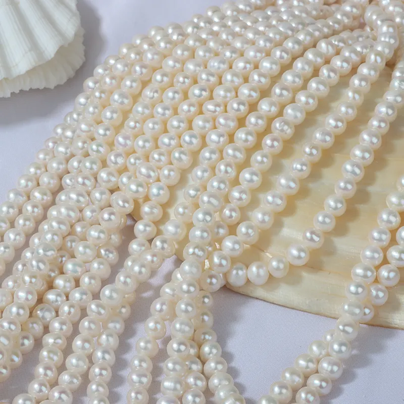 Perlas AA + redondas más rentables, perlas sueltas de agua dulce blancas redondas cultivadas naturales de 6mm para venta al por mayor
