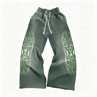 Pantalon de survêtement épais vert délavé style vintage, avec logo imprimé double face, taille élastique et cordon de serrage, coupe ample et décontractée