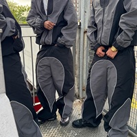 Ensemble de survêtement pour homme, veste et pantalon de course, personnalisé par les fabricants, en Spandex/Coton, à séchage rapide, avec blocs de couleur, patchwork, fermeture éclair et imprimé brodé
