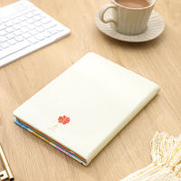 Vente en gros A5 personnalisé coloré en cuir PU imperméable carnet de notes à couverture rigide Jouranl avec arc-en-ciel couleur bords pulvérisés