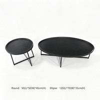 Ensemble de tables basses ovales modernes noires avec plateau en bois grainé et pieds en métal pour salon