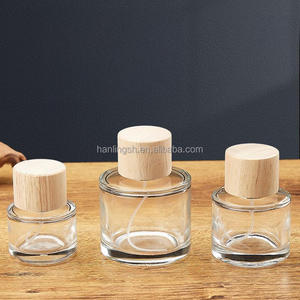 Venta caliente 30ml 50ml 100mL Perfume redondo Engarzado <span class=keywords><strong>en</strong></span> botella de vidrio con bomba tapa de madera para Perfume loción Perfume botella de vidrio - Product Image 1