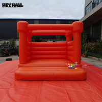 Château gonflable orange vif en PVC commercial durable, idéal pour toutes sortes de fêtes et d'événements