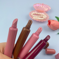 Nouvel arrivage de tube de brillant à lèvres vide rose nude marron mat baume à huile emballage de tubes de brillant à lèvres doux de marque privée