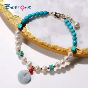 Bestone Natural Fresh Water Pearl Turquoise Red Sea Bamboo Bracelet with Jade Donut Pendant