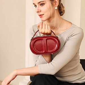 Elegant Women's Genuine Leather Oval <b>Mini</b> Bag With Round Handle Zip Closure Daily Use Handbag - Product Image 1