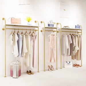 Listo para enviar, estante de ropa de Metal bonito a la moda, estante de ropa montado en la pared dorado de acero inoxidable para exhibición de <span class=keywords><strong>tienda</strong></span> de mujeres Boutique - Product Image 3