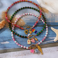Collier pendentif perlé, motifs étoile de mer, cœur, poisson, œil, fleur, hippocampe, crabe, coquille, enveloppe, tortue, trombone, vis, tendance