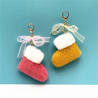 Porte-clés de Noël en peluche mignon le plus vendu, avec nœud et motif chaussette de Noël, pendentif pour sac cadeau de fêtes
