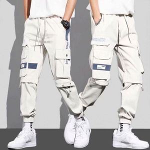 Wholesale Men <b>Tape</b> Loose <b>Binding</b> Pants Casual Trousers Punching Pants Patchwork Loose Cargo Pants Fashion Style - Product Image 4