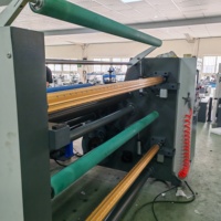 Nouveau type de rouleau de papier imprimé artisanal en carton entièrement automatique pour rouler la machine à refendre avec enrouleur d'arbre à air