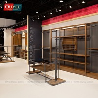 Présentoir à vêtements en acier inoxydable OUYEE pour magasin de détail, support personnalisé pour chemises en tissu