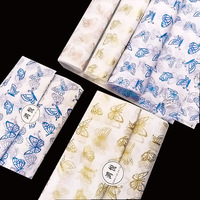 Papier de soie romantique à découpes papillon filigranées pour le rembourrage des boîtes de dragées de mariage et l'emballage de cadeaux de fête prénuptiale