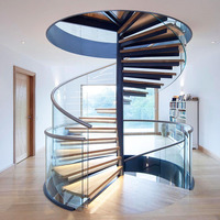Escalier en colimaçon rond en acier moderne avec marches et garde-corps en verre, système de kit pour la construction d'intérieur