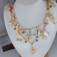 Nouveau collier ras du cou multicouche avec pendentifs étoile de mer, hippocampe, coquillage, coquille de tortue et perle