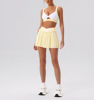 Ensemble deux pièces jupe de tennis et soutien-gorge de sport dos nu pour femme, personnalisable avec logo, idéal pour l'entraînement et la vente en gros