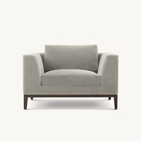 Ensemble Fauteuil et Ottoman en Tissu Texturé Gris Moderne de Luxe Français Élégant, Chaise Longue Confortable à Accoudoirs Larges et Rembourrés pour Hall d'Hôtel