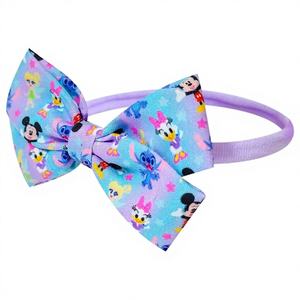 H.E.R. Accessoires en gros officiels sous licence pour bébés : Adorables bandeaux et nœuds Minnie, doux, élastiques, classiques intemporels - Product Image 1