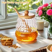 Vente en gros de bouteilles de stockage de logo personnalisé pots en verre de miel récipient en verre pour le miel