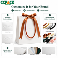 Sacs en papier kraft blanc personnalisés avec logo Ccpack, poignée tressée de luxe, ruban à nœud, emballage cadeau pour bijoux, boutique de mode