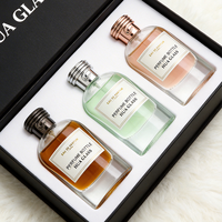 Vente en gros de flacons de parfum vides de 100 ml, rechargeables, étanches, avec un motif unique sur le bouchon, flacon en verre personnalisé avec boîte cadeau