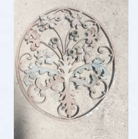Rosace décorative en acier martelé avec feuilles estampées
