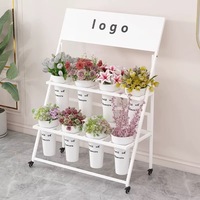 Présentoir de fleurs en acier de luxe avec éclairage mobile, seau en plastique et échelle légère pour décorations de Pâques en magasin