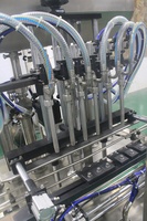 Machine de remplissage automatique de liquides à pistons multi-têtes |   Contrôle servo, haute précision pour les liquides visqueux et non visqueux