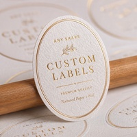 Autocollants en papier texturé ovale avec logo estampé à chaud pour l'emballage de produits faits à la main