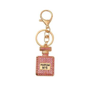 Porte-clés créatif en métal avec strass, pendentif de voiture orné de diamants, flacon de parfum imprimé en émail, pendentif de sac pour femme - Product Image 6