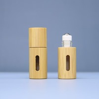 Sortie d'usine 10ml rouleau de verre de coquille de bambou sur des bouteilles pour les huiles essentielles avec des boules de rouleau d'acier inoxydable