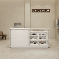 Comptoir de réception moderne et minimaliste avec vitrine en verre, comptoir de caisse de luxe pour boutique de vêtements