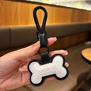 Al por mayor Llavero de piel con diseño de pata de gato de dibujos animados, llavero con forma de hueso para coche, colgante adorable para mochila, regalo - Product Image 3