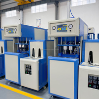 Machine de soufflage de bouteilles PET semi-automatique à deux cavités, économique, capable de fabriquer des bouteilles d'eau minérale, des bouteilles de boissons, des bouteilles de jus