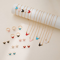 Lot de 4 bijoux en alliage : Collier pendentif mini papillon, élégantes boucles d'oreilles clous papillon et bague pour femme