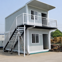 Maison conteneur modulaire préfabriquée à deux étages en acier avec escalier extérieur pour bureau, dortoir ou camp de travailleurs