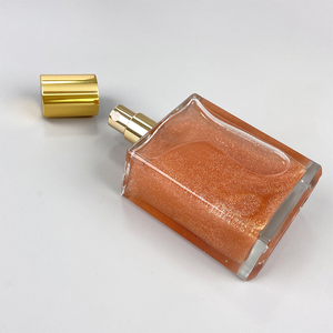 Huile corporelle illuminatrice professionnelle MLM OEM ODM 100ml, flacon cylindrique, capuchon doré, fini scintillant, végane et bio. - Product Image 6