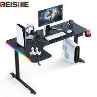 Bureau de jeu en forme de L Wquantm avec structure métallique, surface en MDF mélaminé, système de réglage de la hauteur à moteur unique, bureau à domicile