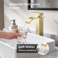 Robinet de lavabo sur pied en acier inoxydable doré poli avec cartouche céramique et bonde escamotable pour salles de bain d'hôtels et d'appartements
