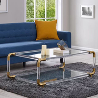 Table basse décorative de luxe à deux niveaux en verre trempé transparent avec cadre en acier inoxydable argenté et pieds en acrylique pour salon