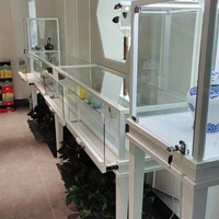 Meilleures ventes : Ensemble de vitrines en verre en acier inoxydable noir, comptoir de présentation de bijoux pour boutiques de luxe, étagère sur piédestal éclairée par LED