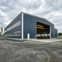 Entrepôt en acier préfabriqué de haute qualité et durable avec porte à enroulement et niveleur de quai – Bâtiments industriels