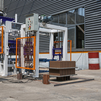 Nouvelle machine de fabrication de briques QT4-15 avec chambre de séchage de ciment à pression statique et formage par vibration hydraulique pour la production de blocs en Ouganda